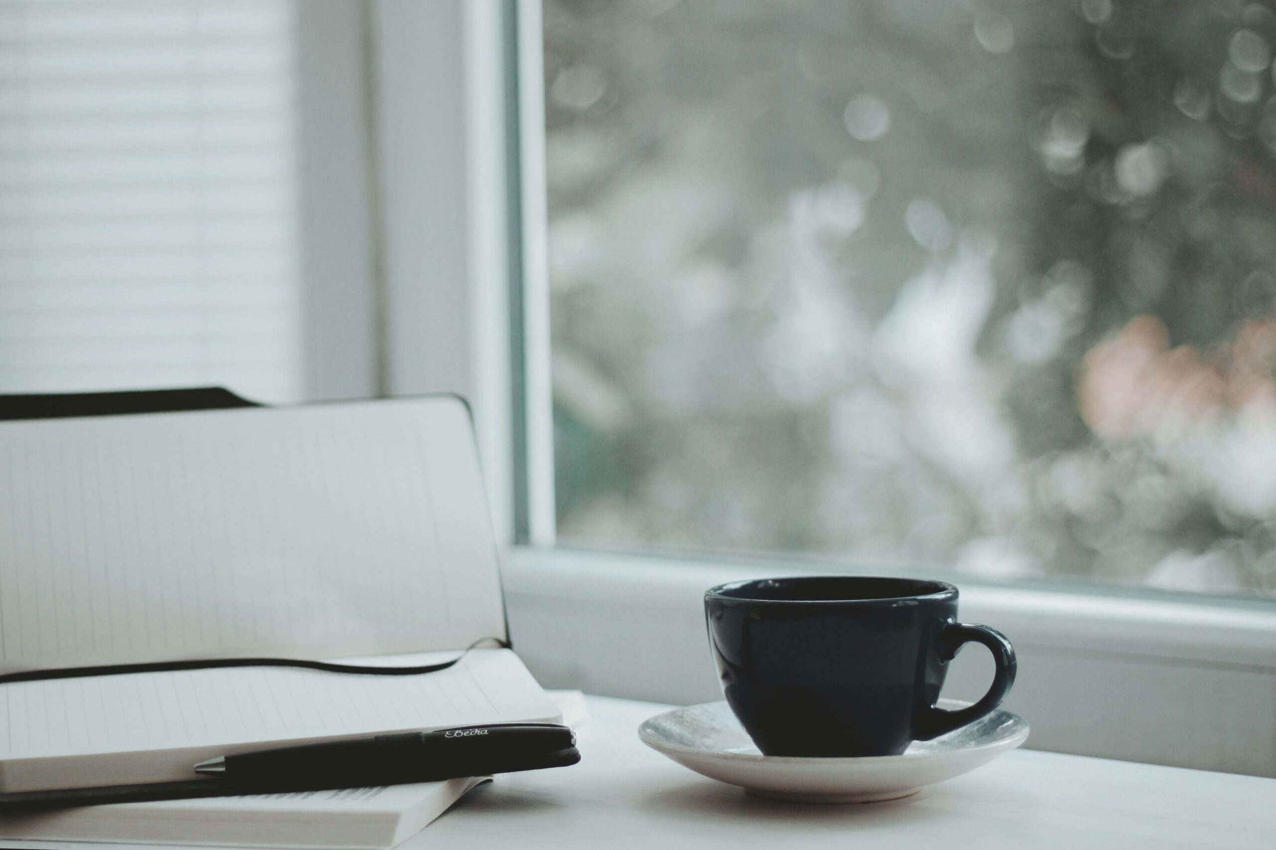 coffee and notebook set on the table